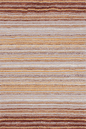 Alfombra Dune sobre fondo blanco, destacando sus tonos marrones y cremas que aportan un toque de sofisticación y calidez a cualquier espacio del hogar. Su diseño natural crea un ambiente relajante, perfecto para salones, dormitorios o estudios. Lavable en lavadora, base antideslizante, sin pelusas e hipoalergénica.