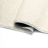 Tapis à poils longs beige